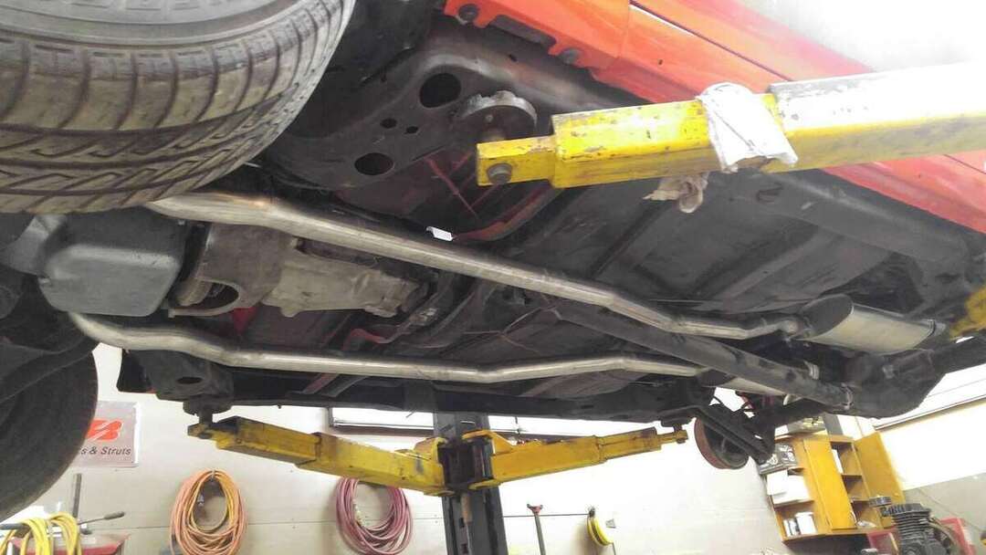 Dual exhaust pipes aligned along the vehicle underside
