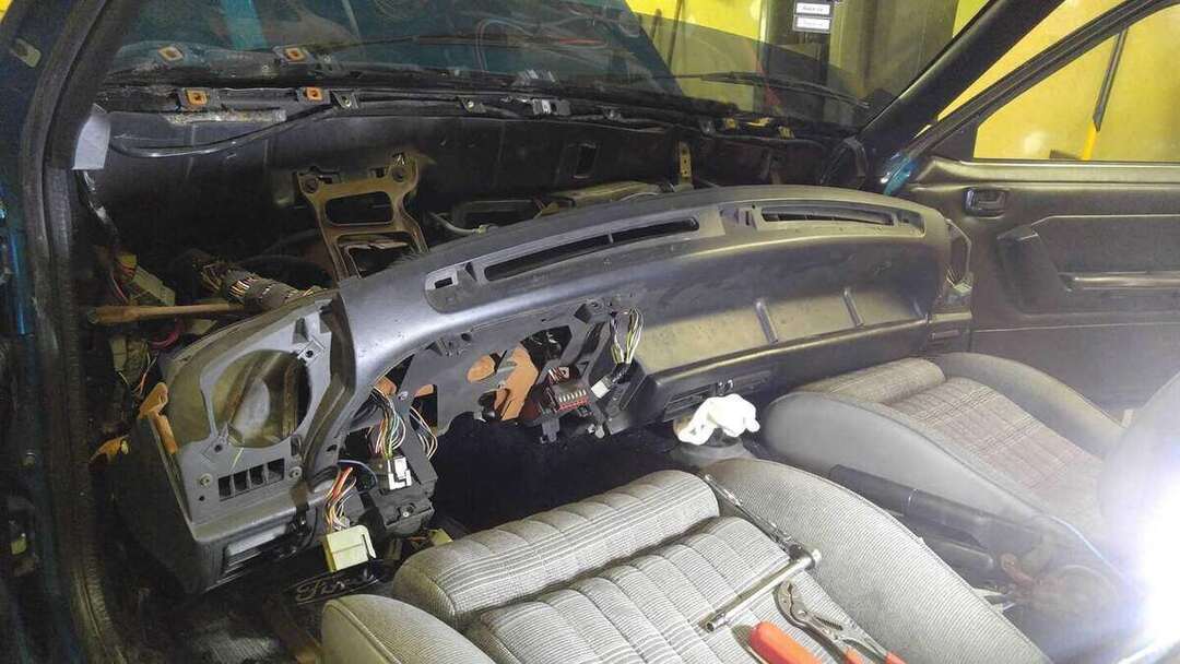 Fox-body dashboard structure staged during reassembly