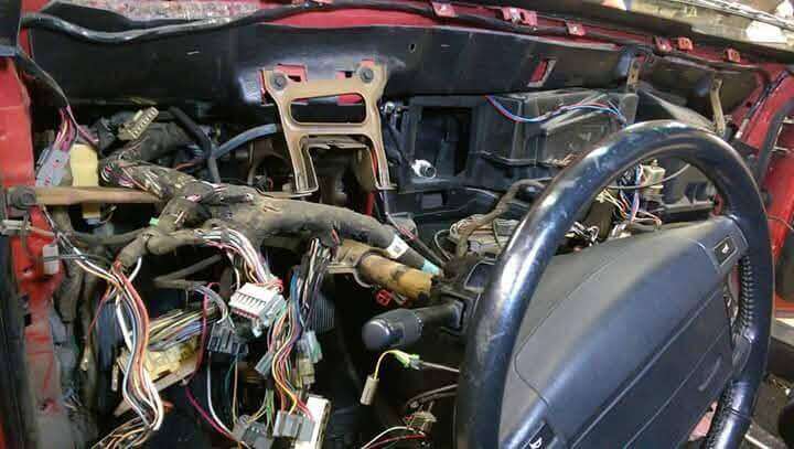 Mustang instrument panel removed with wiring exposed