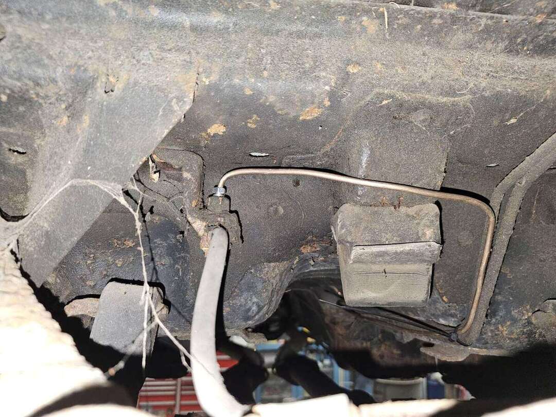 Replacement brake line installed beneath a 1992 Ford Mustang GT in Raymond New Hampshire