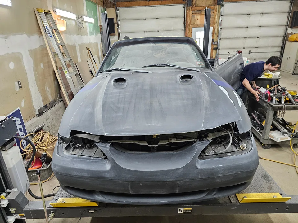 Front of the 1997 Ford Mustang GT convertible with the hood sanded and headlights removed