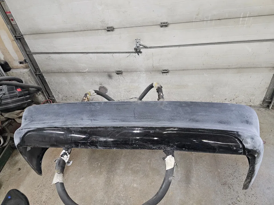 Alternate view of the removed Mustang bumper cover showing sanded areas
