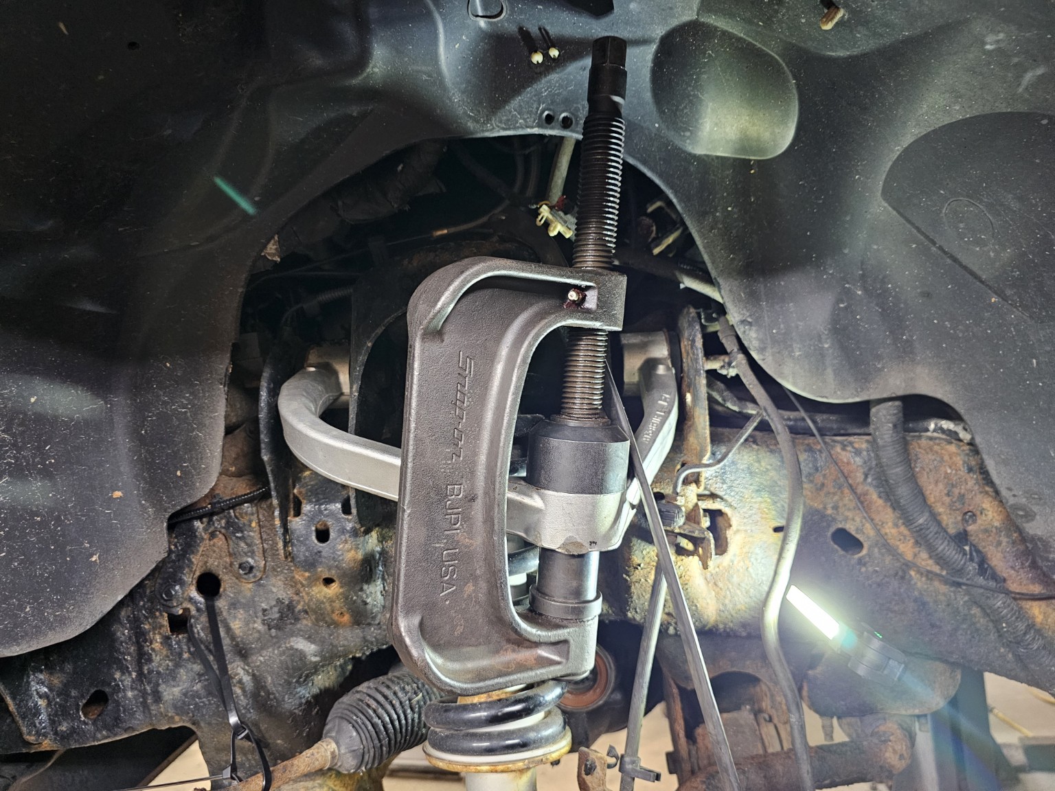 Upper ball joint service on a 2011 Ford F-150 front suspension