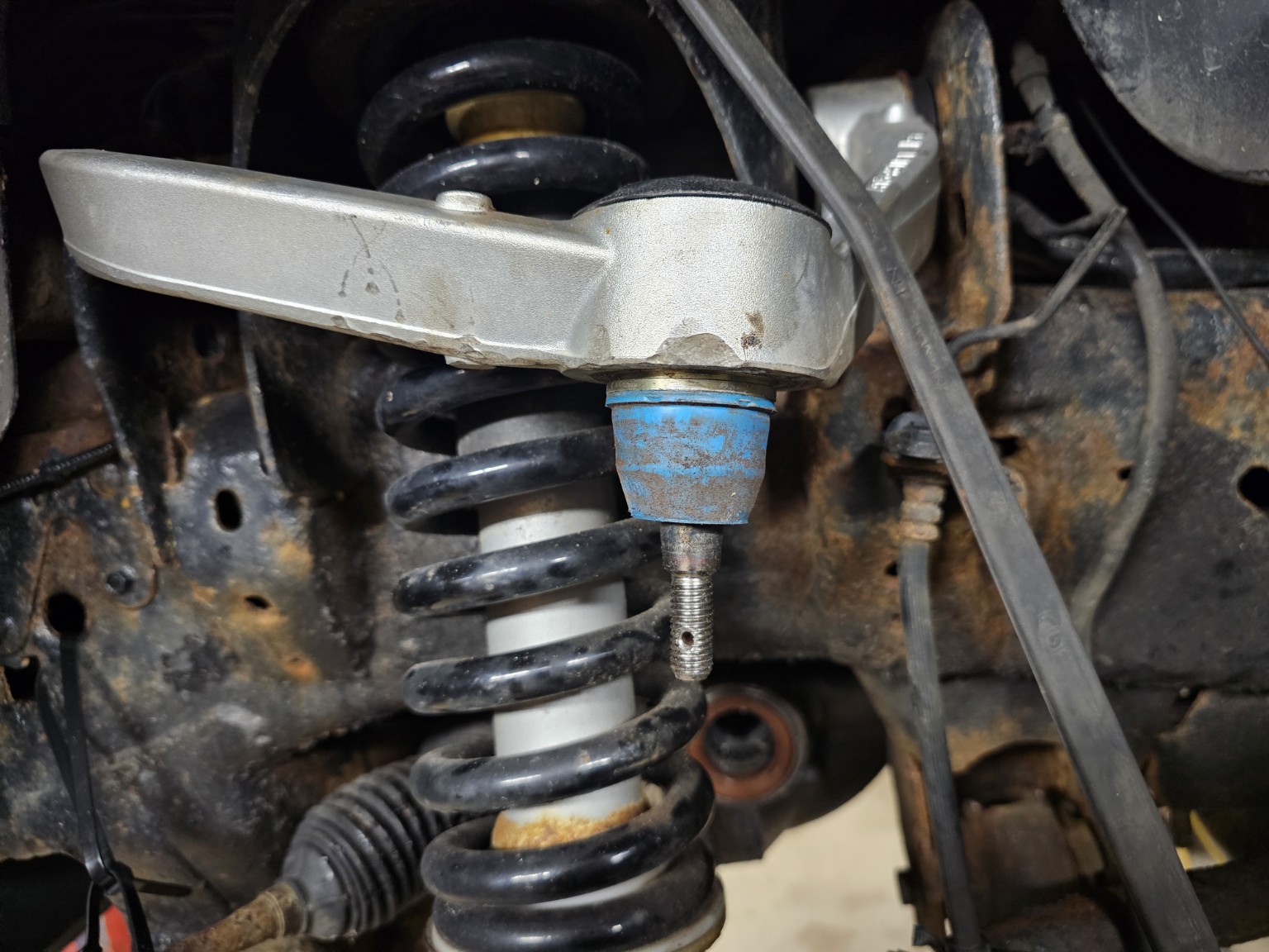 Upper ball joint and control arm on a 2011 Ford F-150 during repair