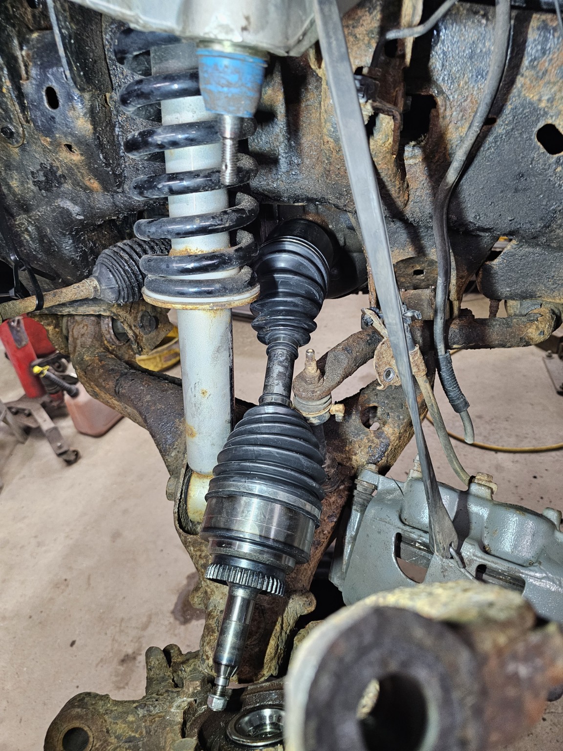 Replacement CV axle installed in the front suspension of a 2011 Ford F-150