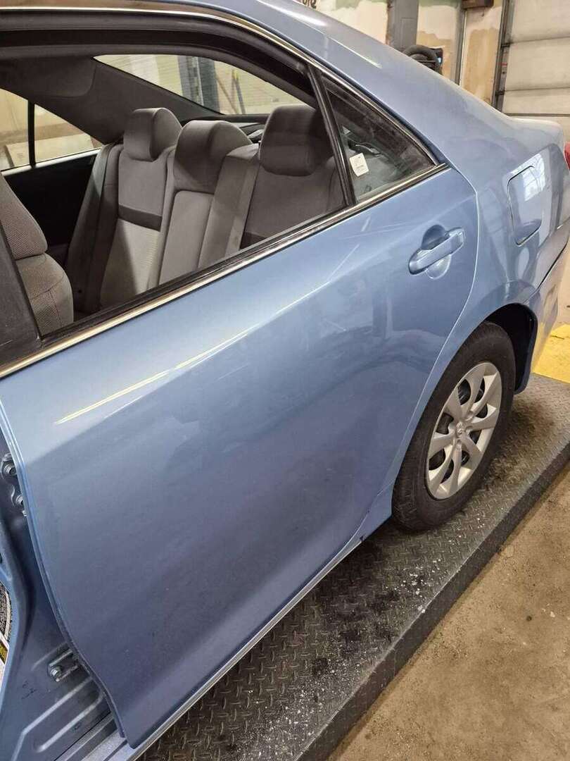 Finished Toyota Camry driver-side replacement doors with aligned body lines