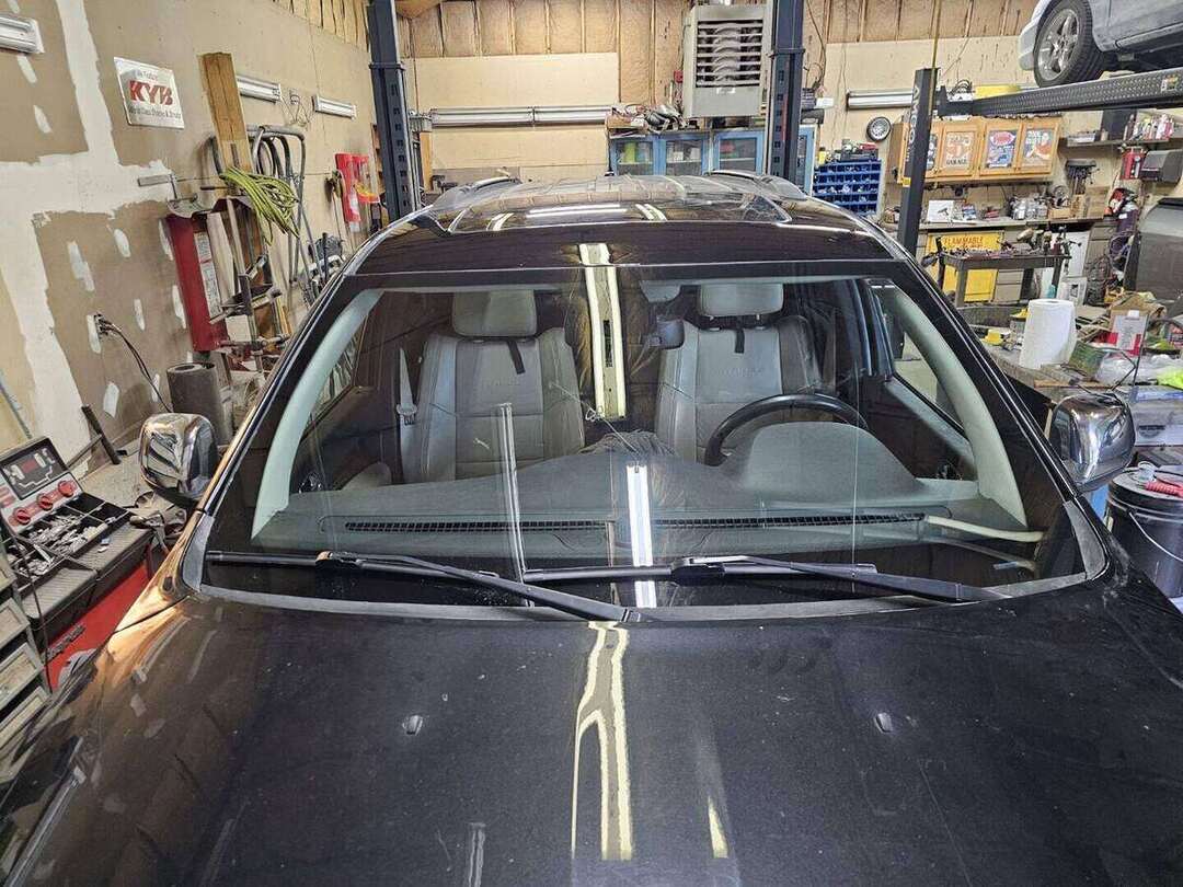 Completed 2013 Dodge Durango roof rust repair above the windshield in Raymond New Hampshire