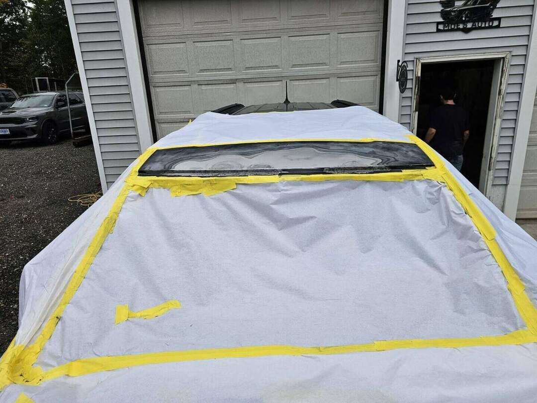 Dodge Durango roof edge prepared for primer after windshield rust repair