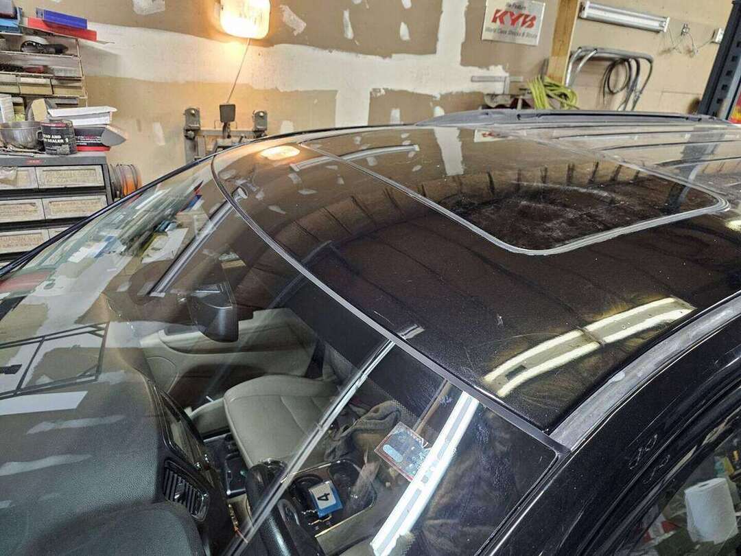 Finished black Dodge Durango roof and windshield after rust repair