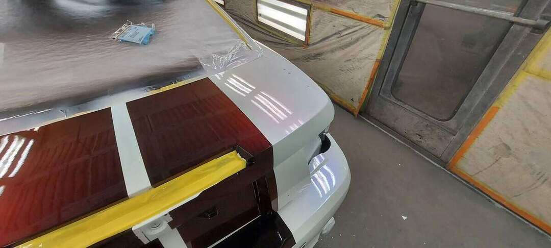Close view of detailed stripe masking on a Mustang hood