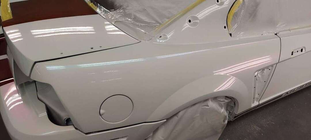 Rear quarter of the Mustang during final body and paint work